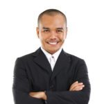 14639807 - confident southeast asian businessman crossed arms over white background